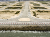 A view of a completed section of the Eko Atlantic Promenade atop The Great Wall of Lagos with Eko Boulevard in the distance