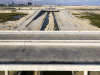 A view of the bridges going over a completed section of the Canal. The sand in the middle of the canal will soon be removed and roads will be constructed on both sides of the Canal