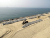 An aerial view of the Accropodes laid out to be placed on the Great Wall of Lagos