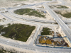 An aerial view of the road network in Eko Atlantic. The roads in this image can be seen going over the canal, around the canal, and descending to the canal