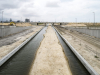 A completed section of the Canal. The sand in the middle will soon be removed and roads will be constructed on both sides of the Canal