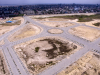 An aerial view of the road network at the North West Side of Eko Atlantic. The completed roads are all serviced by underground drainage, street lights, and are lined by vegetation. In the middle of the image is the Eko Boulevard Round-A-Bout