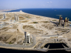 A view of Eko Atlantic facing east. The large circular road towards the middle of the image will be the ring road that surrounds the Marina District. The image also shows towards the left, Eko Pearl Towers, the middle, Alpha 1, and the right, Azuri Peninsula Towers.